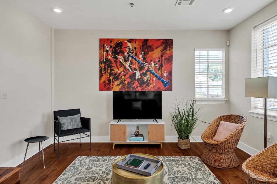 The Licorice mural — Pete Fountain playing the clarinet, painted in splashes of gold, green, and blue in the main room
