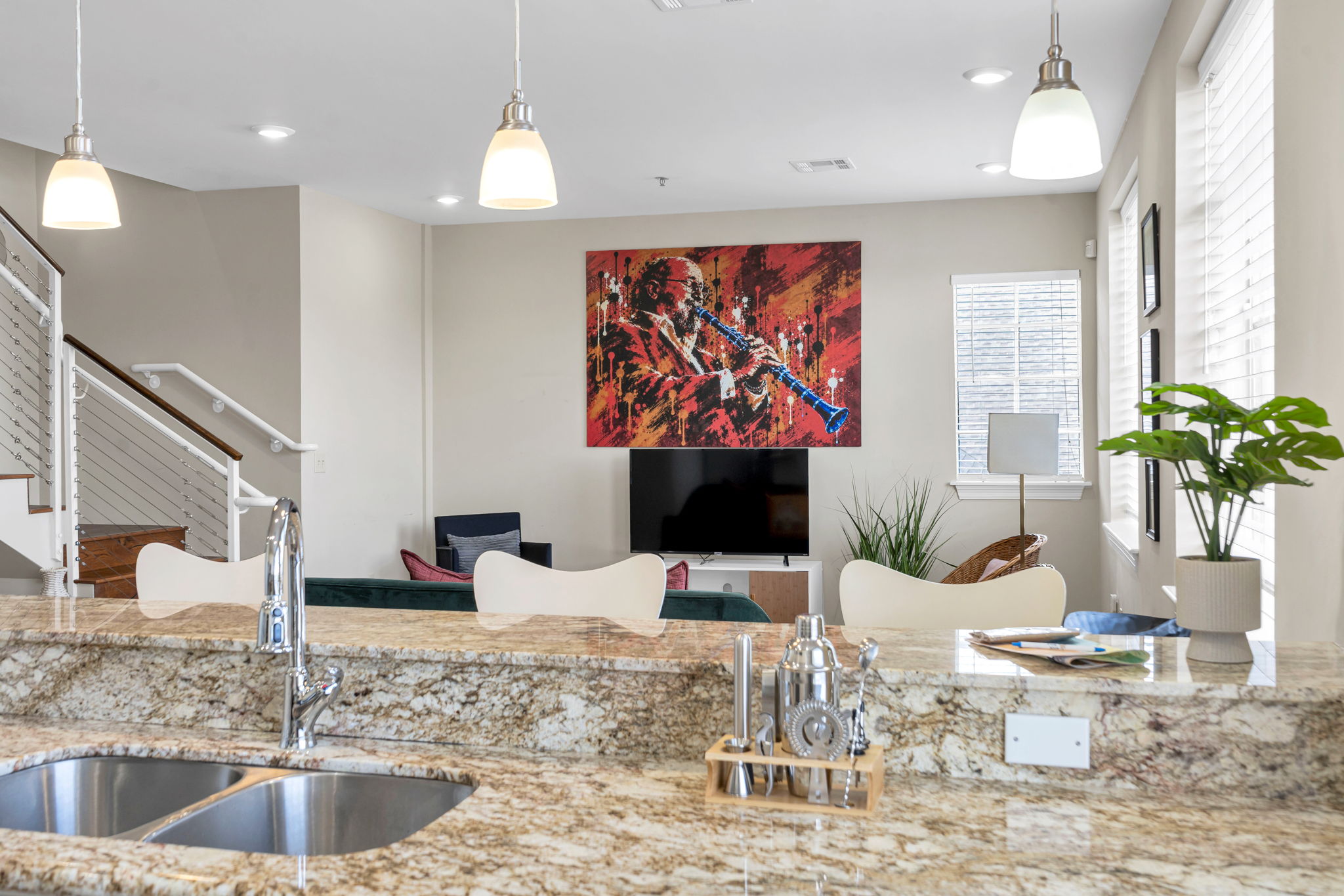 The kitchen in The Licorice suite, looking across the counter to the mural in the living space