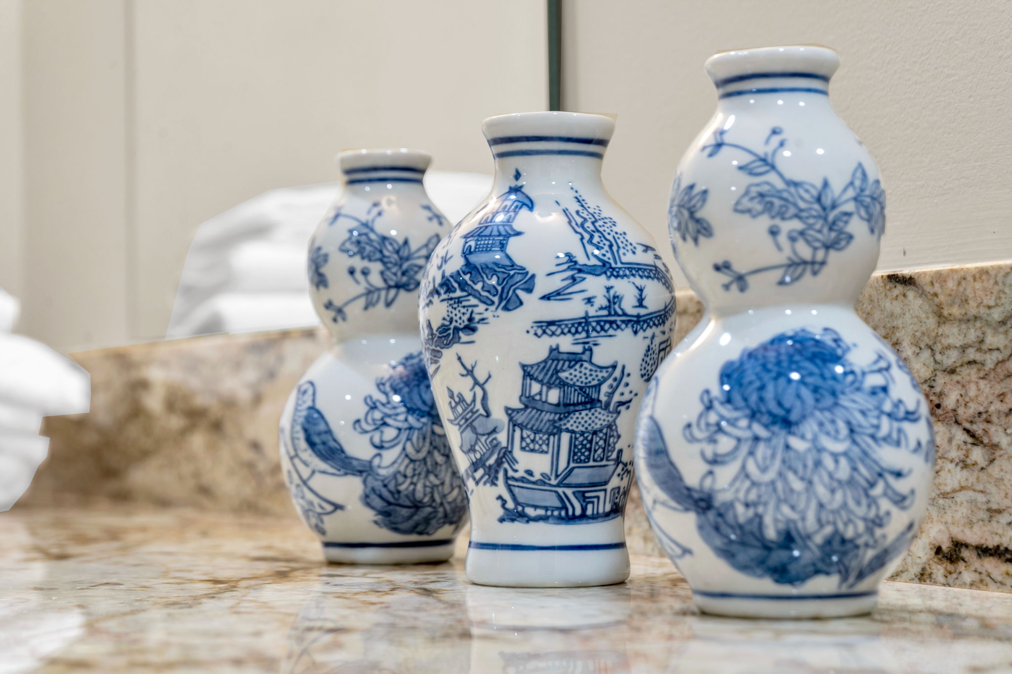 Blue-and-white porcelain vases on the marble vanity in The Licorice suite