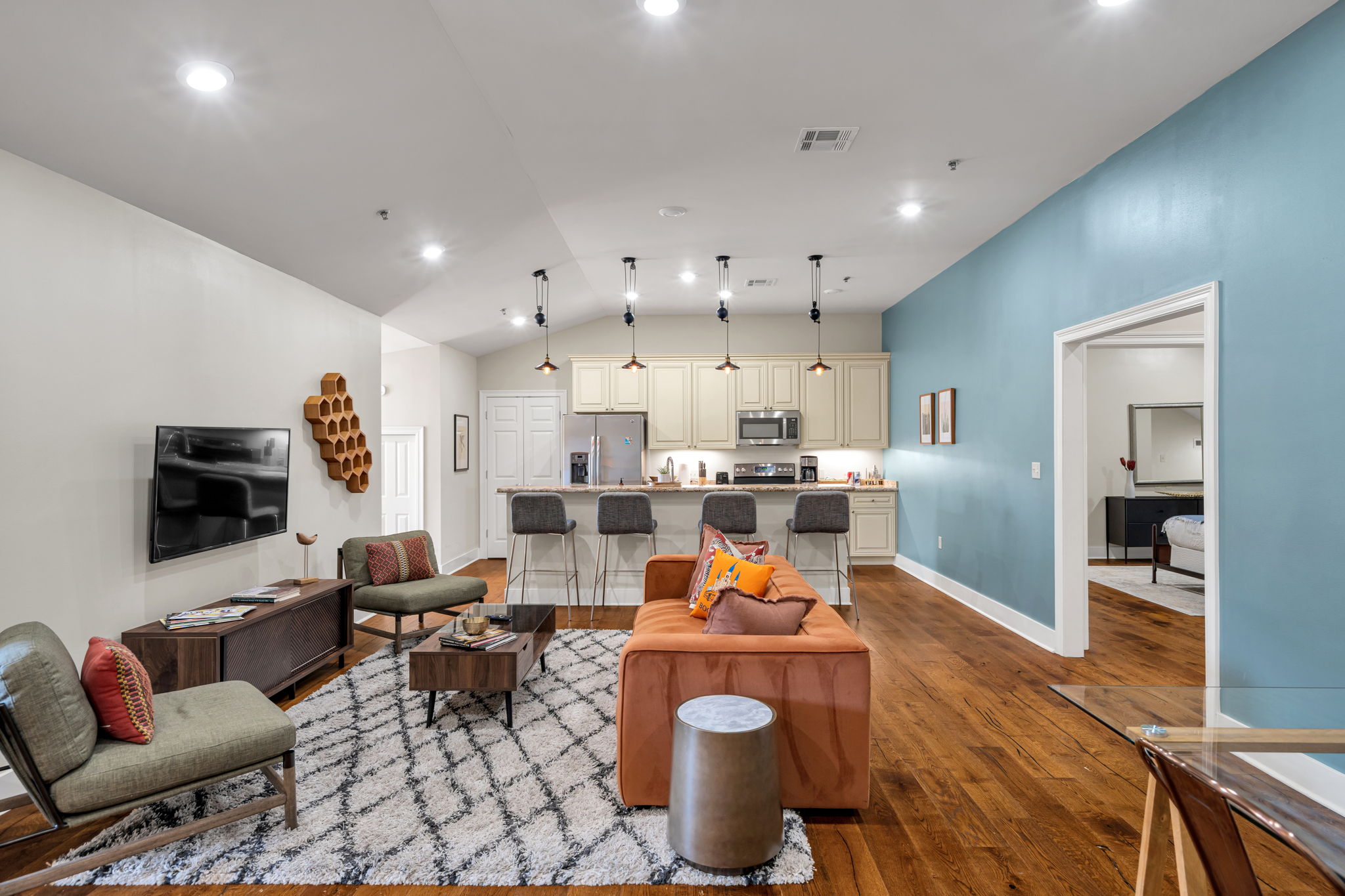 The Delta suite from the dining end — across the living room to the kitchen