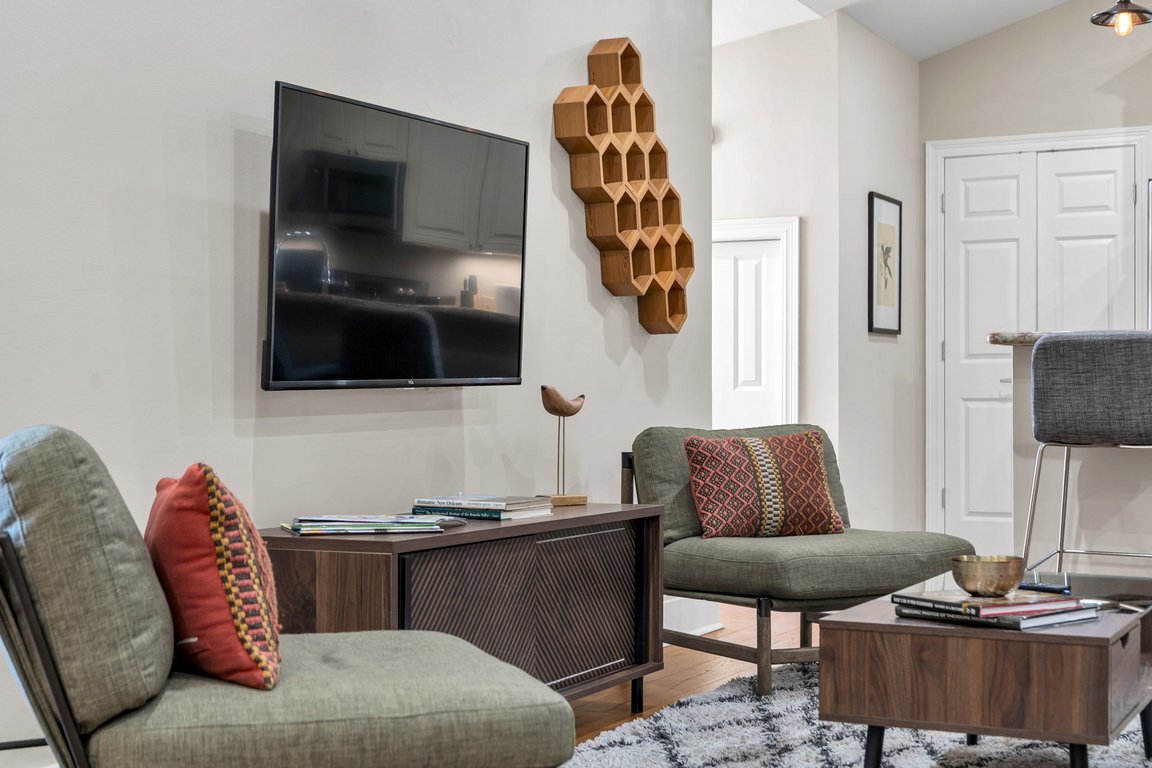 The TV wall and honeycomb shelf in The Delta suite